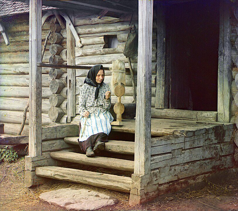 "Russian Woman Spinning Yarn, Izvedovo Village," by Sergey Prokudin Gorsky.