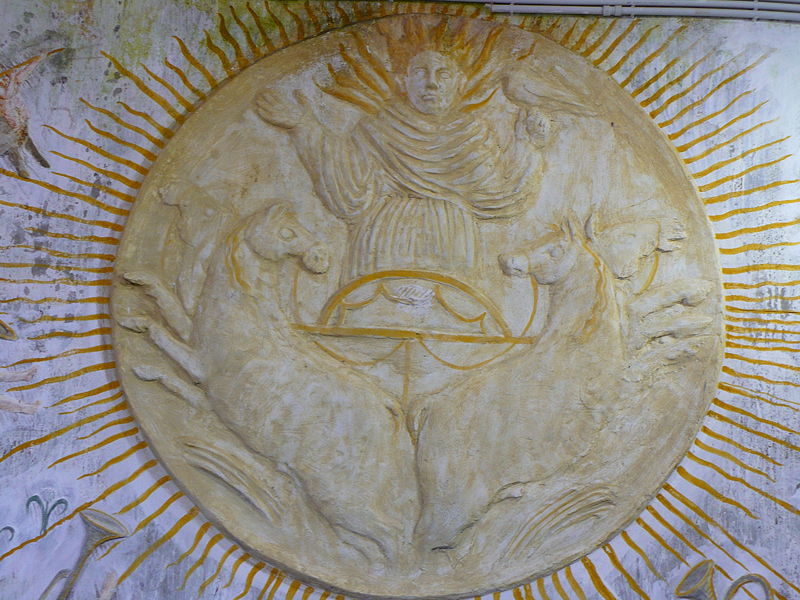 Stone symbol of the sun placed inside the "Temple of the Sun" in the La Mortella Gardens in Forio, Ischia, Italy.